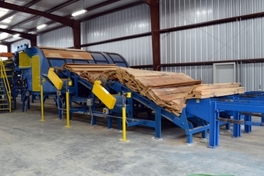 Unscrambler being fed by an infeed deck and double break-over conveyors